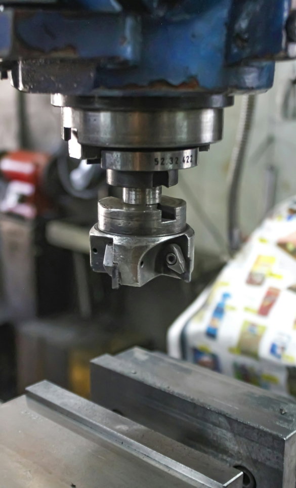 a-machine-that-is-working-on-a-piece-of-metal.jpg A machine that is working on a piece of metal